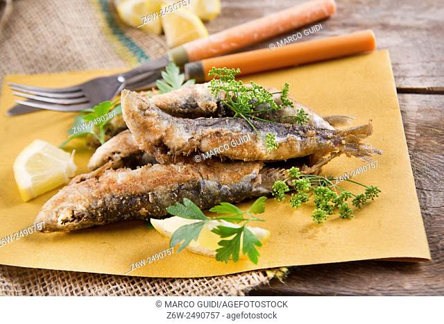 Presentation of a seafood platter, fried anchovies