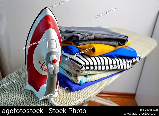 an iron with ironed laundry