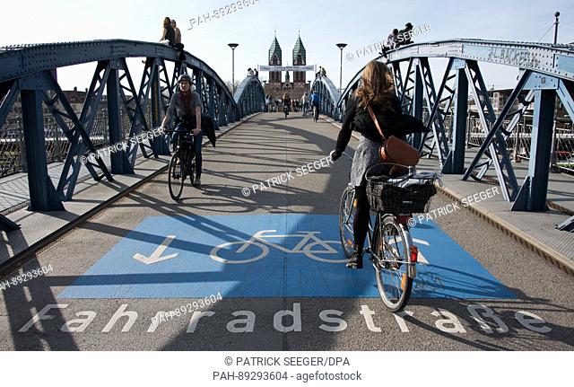 Cyclists crossing the Blue Bridge in Freiburg, Germany, 23 March 2017. The government of the German state of Baden-Wuerttemberg has presented its bicycle...
