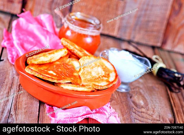 pancakes in bowl and on a table
