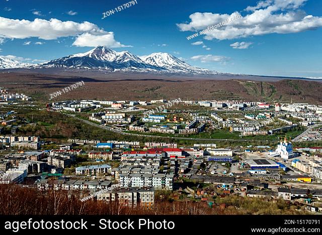 Panoramic view of the city Petropavlovsk-Kamchatsky and volcanoes: Avacha Volcano and Kozelsky Volcano. Far East, Russia, Kamchatka Peninsula