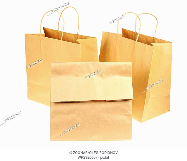 Empty brown recycled paper shopping bags isolated on white background