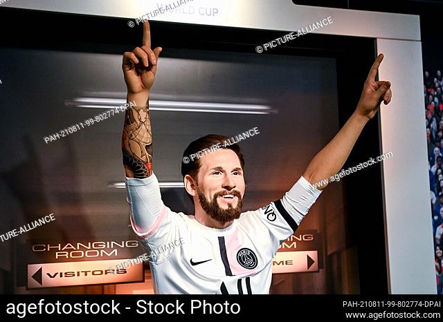 11 August 2021, Berlin: The wax figure of footballer Lionel Messi stands at Madame Tussauds Berlinder and wears the jersey of Paris Saint-Germain