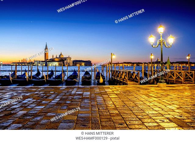 Italy, Veneto, Venice, gondolas in front of San Giorgio Maggiore at dusk