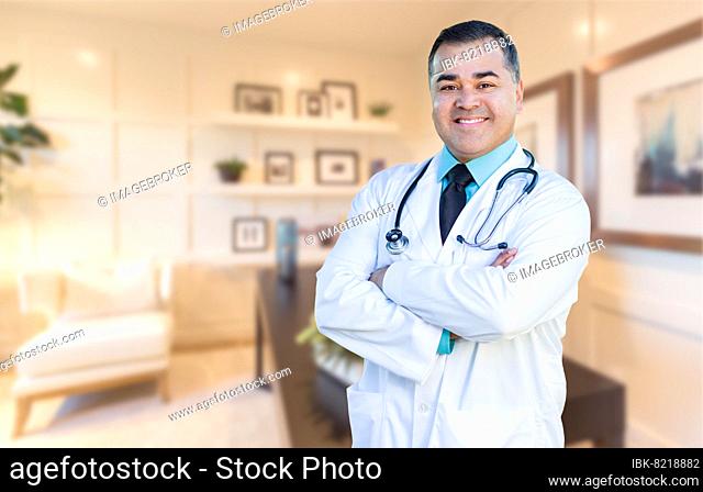 Handsome hispanic doctor or nurse standing in his office