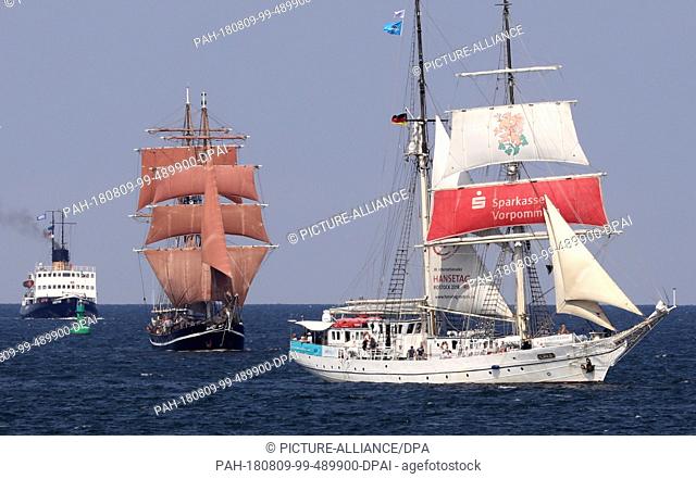 09 August 2018, Germany, Warnemuende: Traditional sailing ships and museum ships are on their way on the Baltic Sea for a first trip at the Hanse Sail