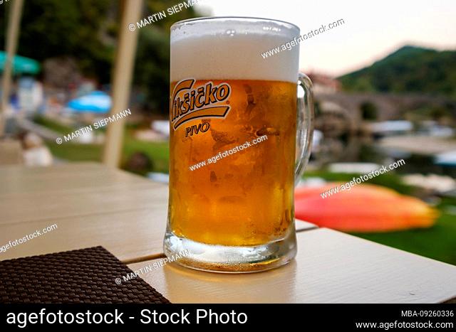 Beer glass with Niksicko beer, Rijeka Crnojevica, Cetinje province, Montenegro
