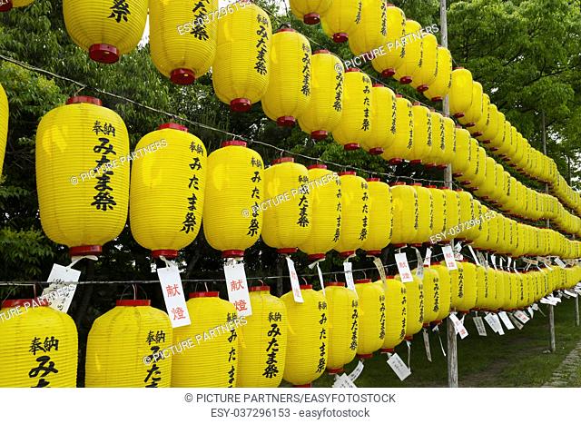 Yellow lanterns with the names of supporters at the Manto mitama matsuri at the entrance of the Hiroshima Gokoku-jinja Shrine