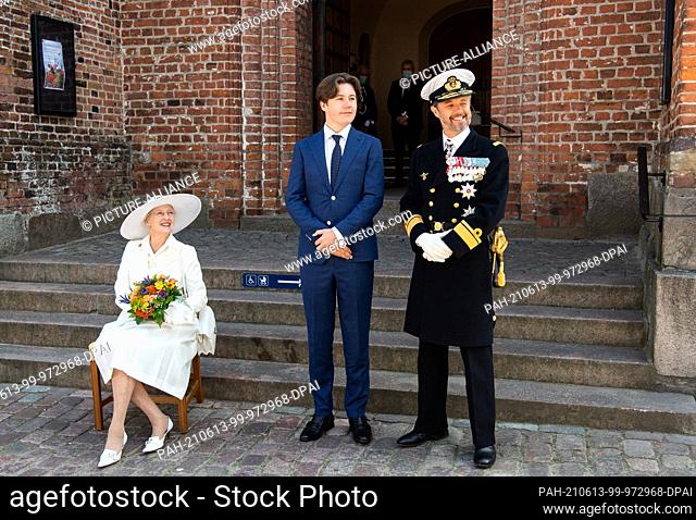 13 June 2021, Denmark, Haderslev: Margrethe II, Queen of Denmark, Crown Prince Frederik, and Prince Christian of Denmark stand at St Mary's Cathedral in...