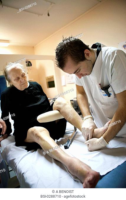 Photo essay from La Croix Saint-Simon Hospital, Paris, France. Department of orthopedics. Physical therapist with a patient who fractured her ankle