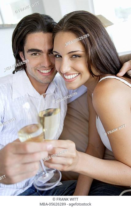 young couple with champagne glasses
