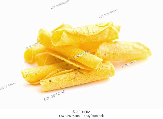 rolled nacho chips on white background