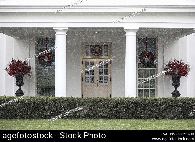 A mix of rain and snow falls outside the West Wing entrance of the White House on December 16, 2020 in Washington, DC. (Photo by Oliver Contreras/SIPA USA)A mix...