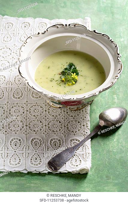 Cream of broccoli soup garnished with broccoli flowers