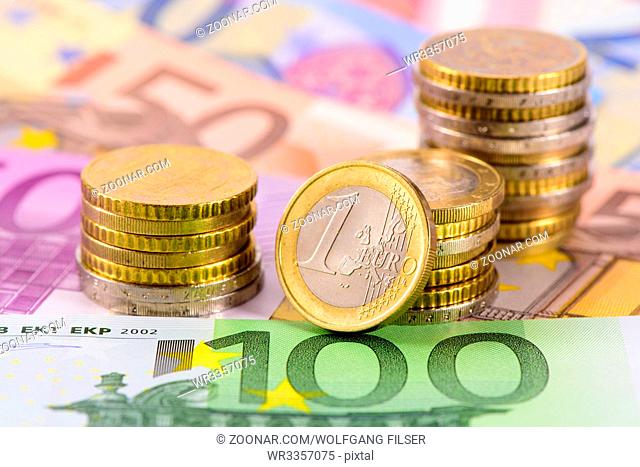 Euro currency with banknotes and stacked coins