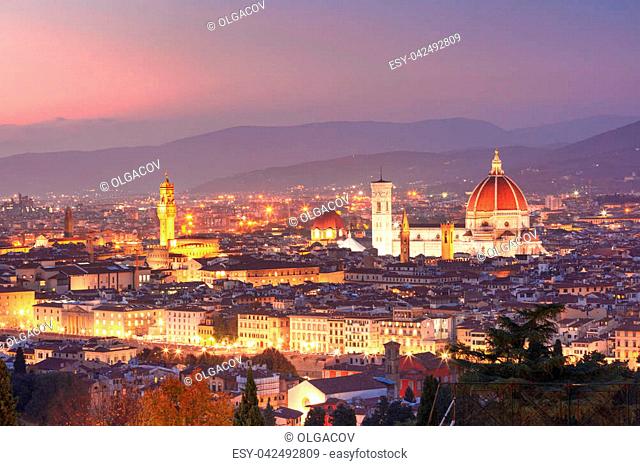 Beautiful panoramic view of Duomo Santa Maria Del Fiore and tower of Palazzo Vecchio during evening blue hour in Florence, Tuscany, Italy