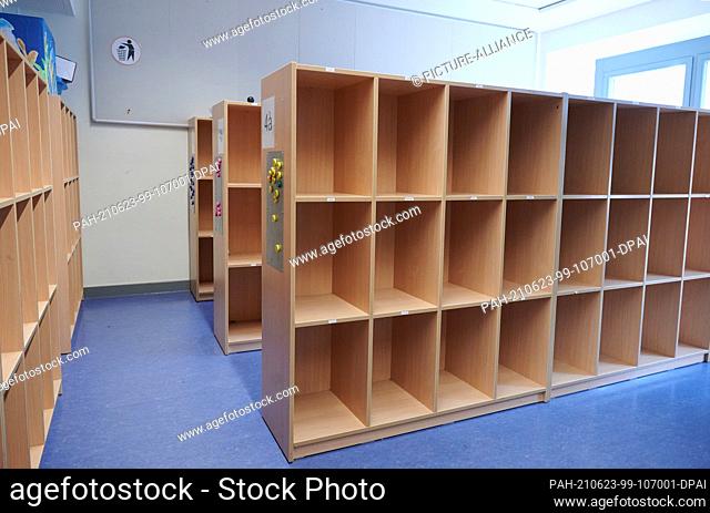 23 June 2021, Berlin: The cubbyholes in the after-school care centre at an elementary school in Prenzlauer Berg are empty