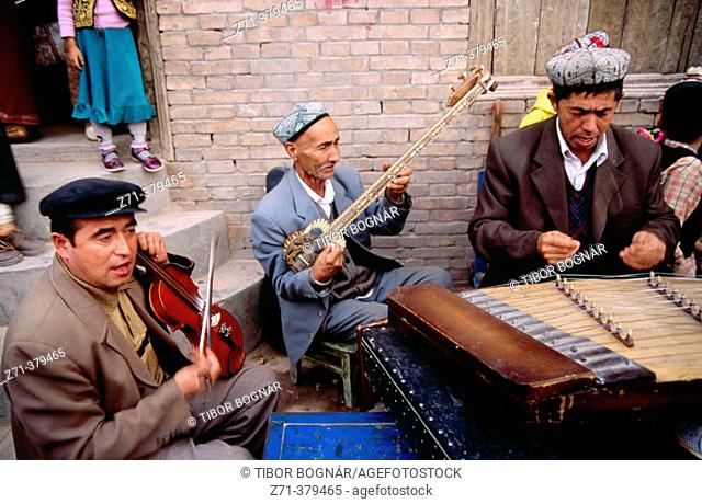 Uighur musicians. Kashgar (Kashi), Uighur Autonomous Region of Sinkiang (Xinjiang), China