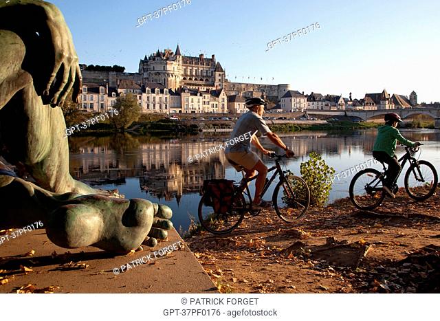 CYCLISTS IN FRONT OF THE ROYAL CHATEAU AND THE BRONZE STATUE PF THE REPRESENTATION OF LEONARDO DA VINCI AS THE DEMIGOD PERSEUS WITH THE HEAD OF MEDUSA ON THE...