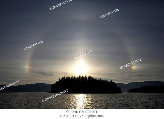 Rainbow and fog bow or sundog over a small island in Douglas Channel, BC, Canada