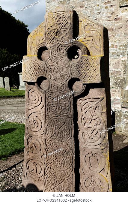 Scotland, Angus, Brechin. An Aberlemno sculptured stone in Aberlemno Kirkyard. The stone features a Celtic Cross in relief and a background of intertwined...