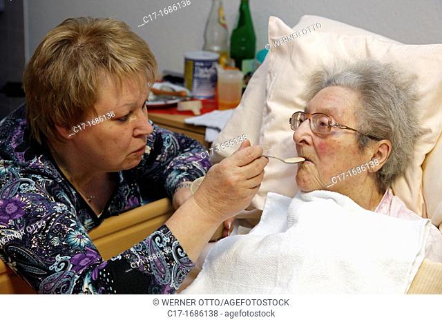 people, old age, retirement home, Altenzentrum der St Clemens Hospitale in Sterkrade, older woman lies in a sickbed, aged 70 to 85 years, physical handicap