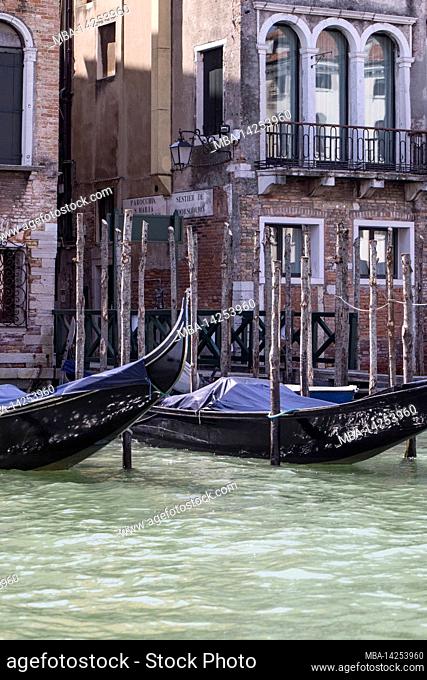 Detail shot of a gondola in front of a palazzo in Venice
