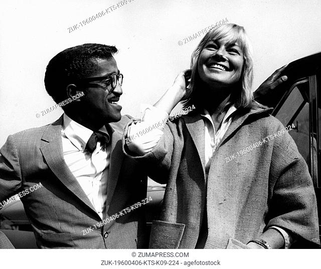 Apr. 6, 1960 - London, England, U.K. - Singer SAMMY DAVIS JR. seen here in London greeting Swedish actress MAY BRITT as she arrived from Hollywood