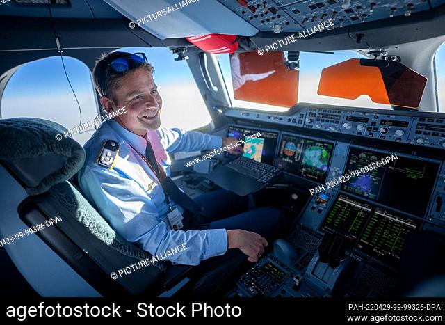 29 April 2022, Nordpol/Berlin: Michael Weyerer, a captain in the German Air Force, sits in the cockpit of the Airbus A350 and steers the plane carrying the...