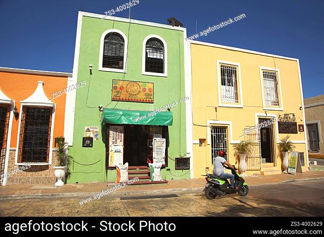 Motorcyclist in front of the colonial buildings at the historic center, Valladolid, Yucatan Province, Mexico, Central America