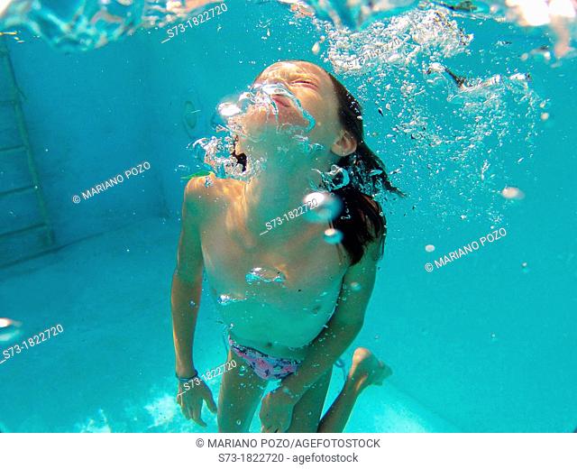 Girl into swimming pool