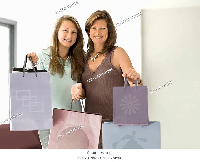 mum and daughter with shopping bags