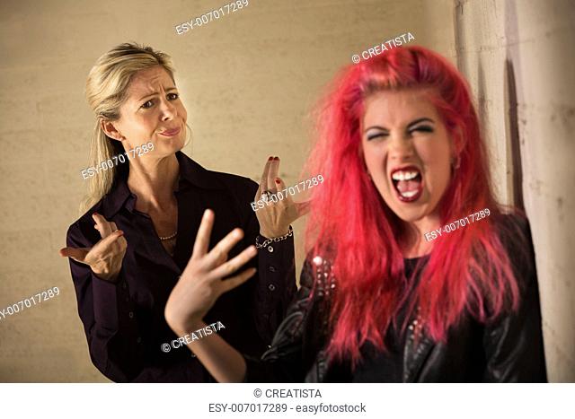 Loud teenage girl in pink hair with disapproving mother