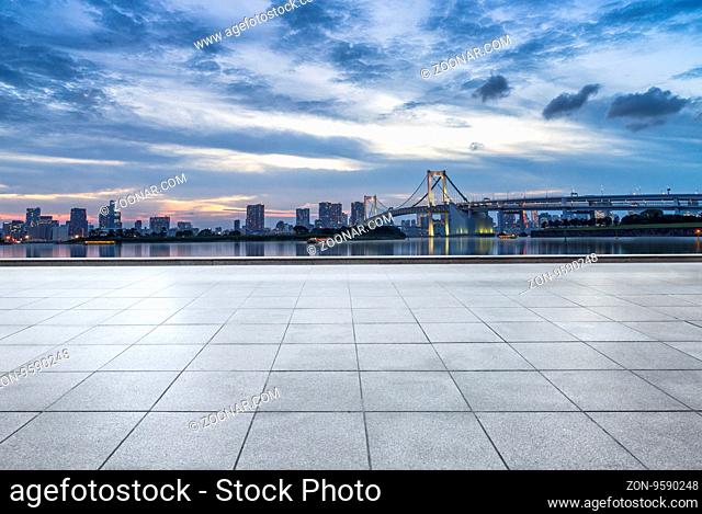 cityscape and skyline of tokyo at sunset from empty floor