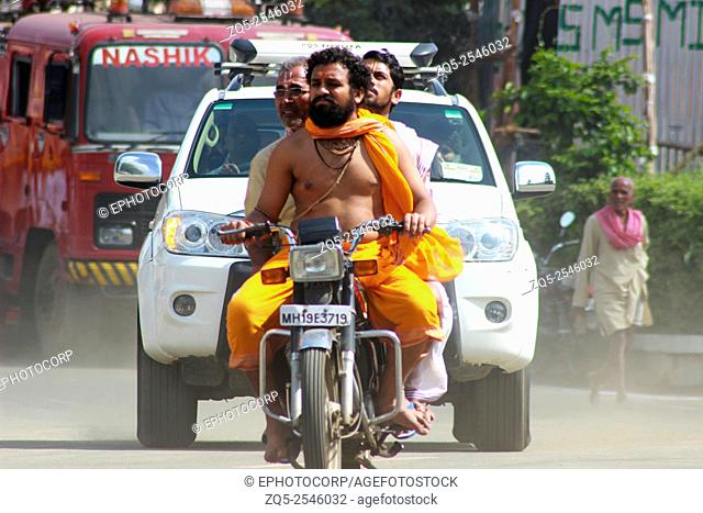 Sadhu on motorcycle Kumbh Mela, Nasik, Maharashtra, India