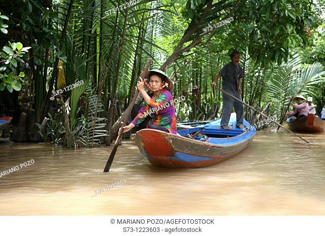 Women rowing. Mekong River, Mekong Delta, My Duc. Vietnam