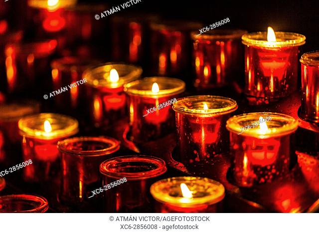 Lit candle set inside a San Cristobal de La Laguna cathedral