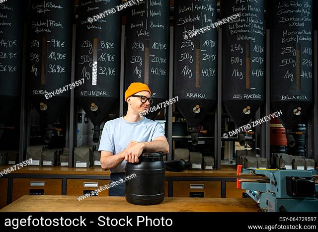 Barista in coffee shop preparing for working day waiting for customers
