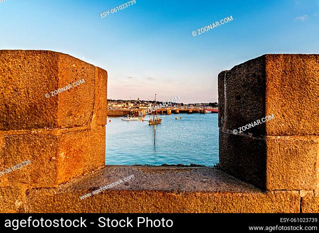 High angle view of the port of Saint-Malo framed for the ramparts at sunset. Brittany, France, Europe