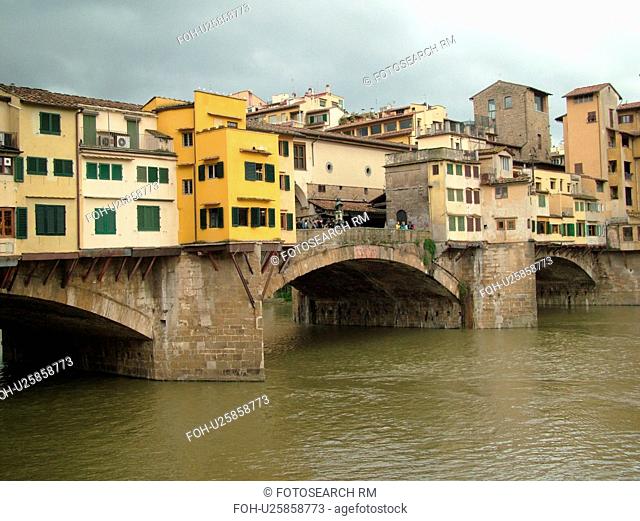 Florence, Italy, Firenza, Tuscany, Toscana, Europe, Ponte Vecchio, a bridge lined with shops, crosses the River Arno in the city of Florence