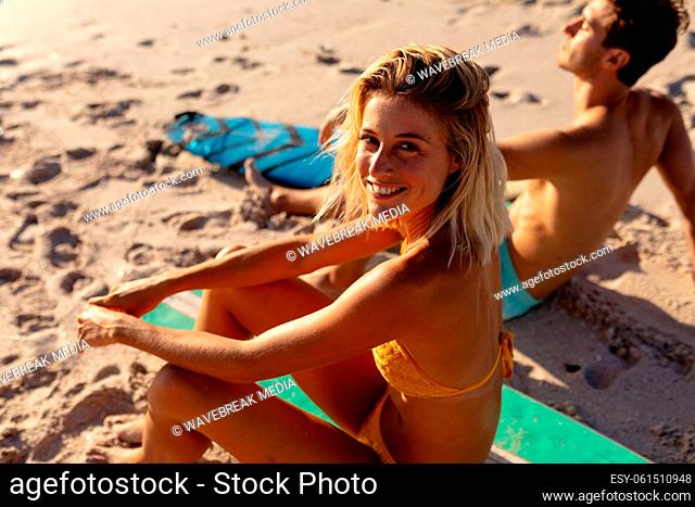 Young Caucasian woman smiling on the beach