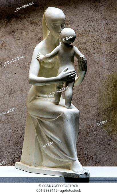 Mother with child, plaster sculpture 1955 by French sculptor Jean Henninger
