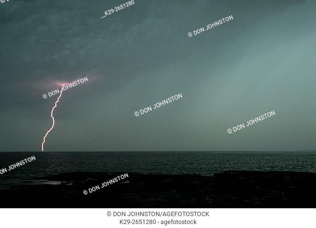 Thunderstorm and lightning strike over Mississagi Strait, Mississagi Lighthouse, Manitoulin Island, Ontario, Canada