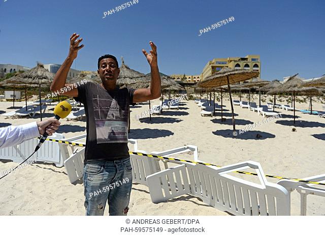 Fauzi El Arbi, who works in the neighbouring hotel, tells a TV crew how the perpetrators shot several people, at the beach of the Imperial Marhaba Hotel in...