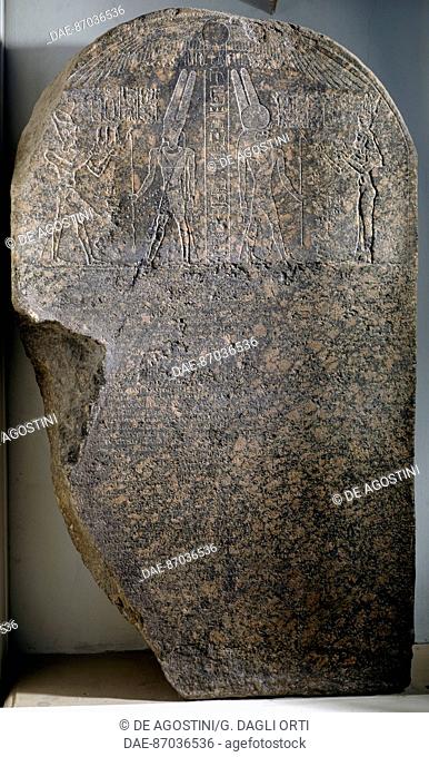 Granite stele known as 'Caesarion', written text and relief depicting the god Amum flattered by a king and god Montu flattered by a Queen, from Memphis