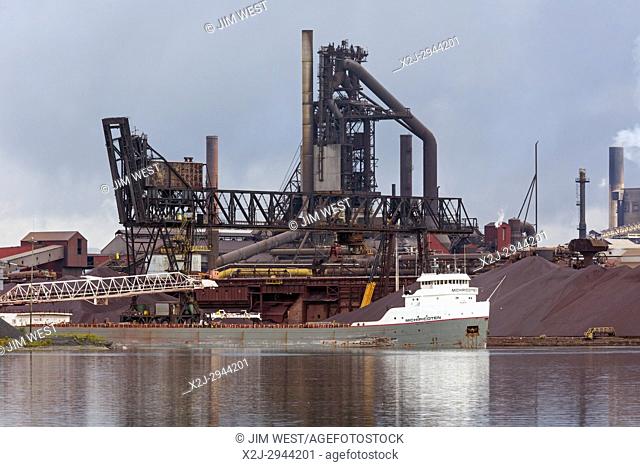 Sault Ste. Marie, Ontario Canada - The Michipicoten, a bulk cargo carrier, docked at the Algoma steel mill on the shore of the St. Mary's River