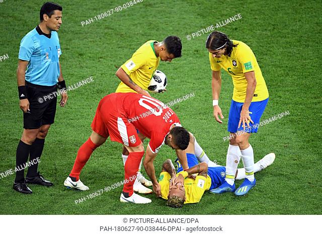 27 June 2018, Russia, Moscow: Soccer, World Cup, Serbia vs Brazil, group E, at the Spartak-Stadium. Brazil's Neymar is on the ground