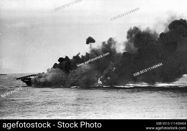Aircraft Carrier Survives ""One-Two"" Punch -- Hit and set aflame by Jap suiced planes, the USS Hancock, Navy Aircraft carrier was stunned and badly shaken