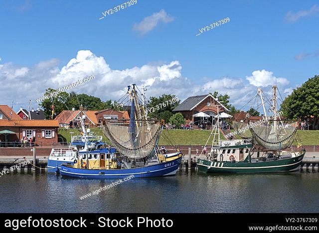 Fishing boats and shrimp boats in the fishing port, Greetsiel, Lower Saxony, Germany, Europe