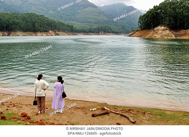 Two ladies at Panniar Lake 22 KMS from Munnar ; Kerala ; India